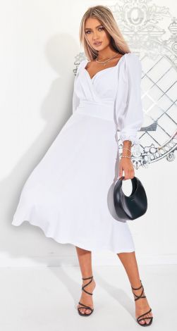 A white dress pleated with a beautiful neckline