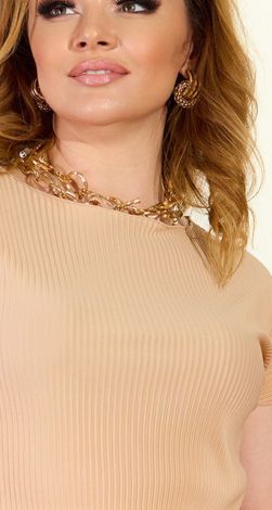 The blouse is pleated